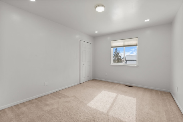 35316 Burgundy, Sterling Heights, MI 48312 - unfurnished room with recessed lighting, baseboards, visible vents, and light colored carpet