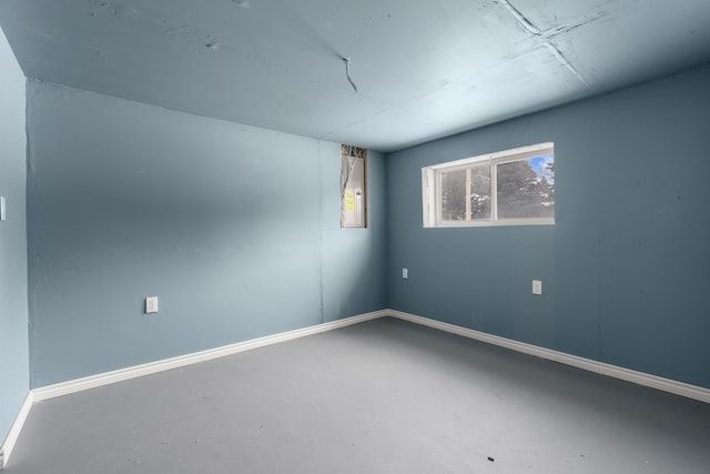 35316 Burgundy, Sterling Heights, MI 48312 - empty room with finished concrete flooring and baseboards