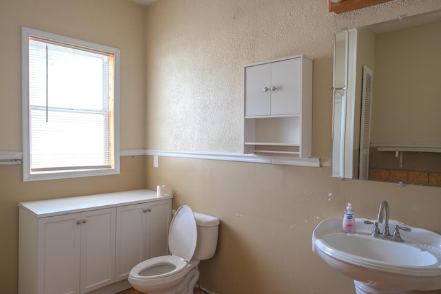 bathroom featuring a sink and toilet