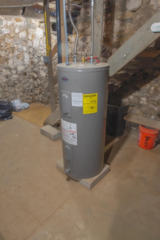 utility room featuring water heater