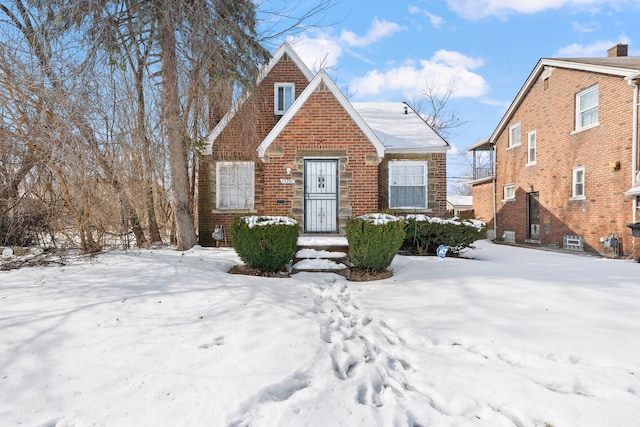 view of front of home featuring brick siding