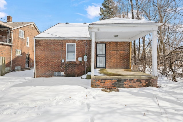 view of front of home featuring brick siding