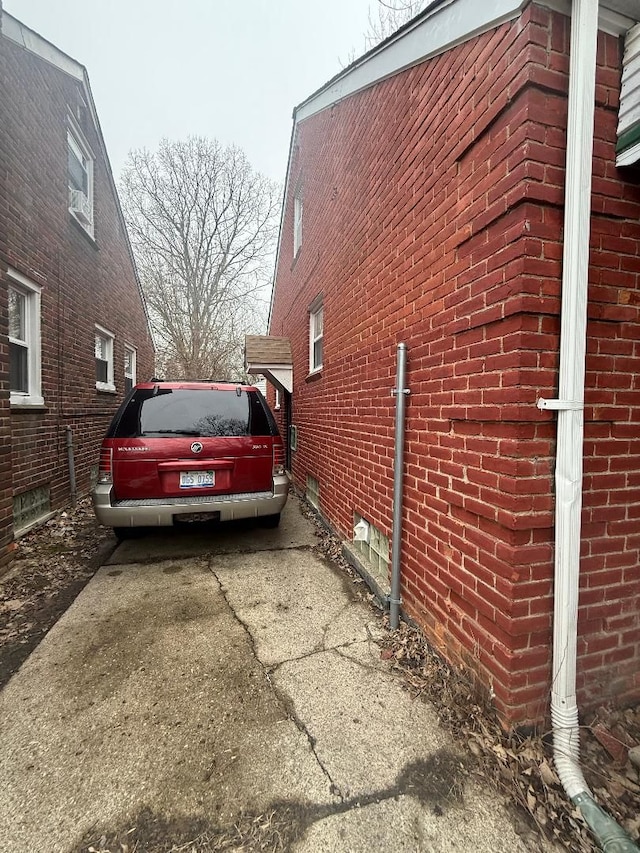 view of side of home featuring brick siding