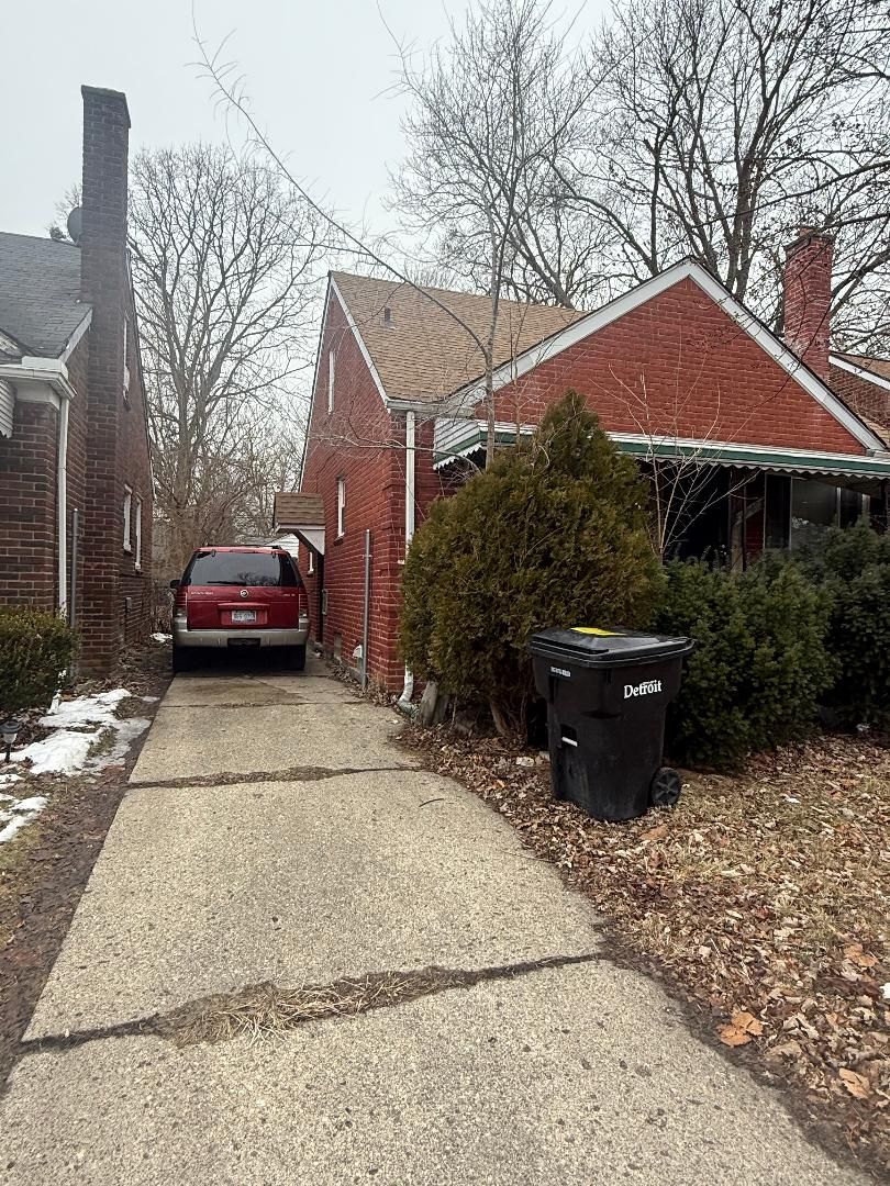 view of side of home featuring brick siding