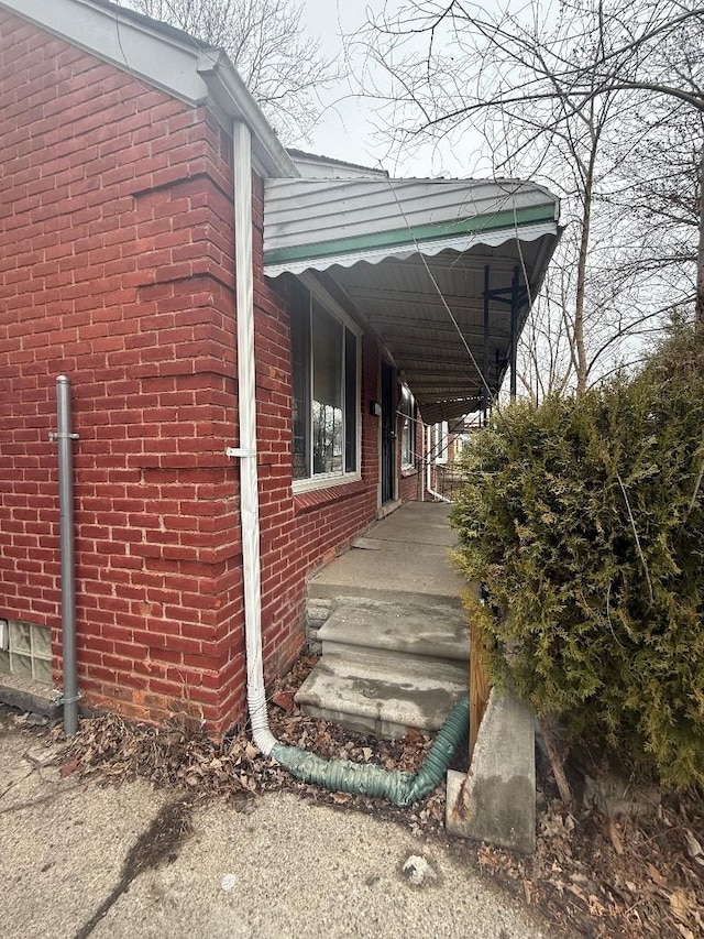 view of property exterior with brick siding