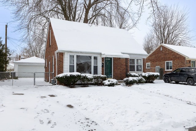 view of front of house with a garage and brick siding