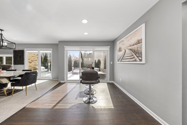 dining room featuring an inviting chandelier, baseboards, dark wood-style flooring, and recessed lighting