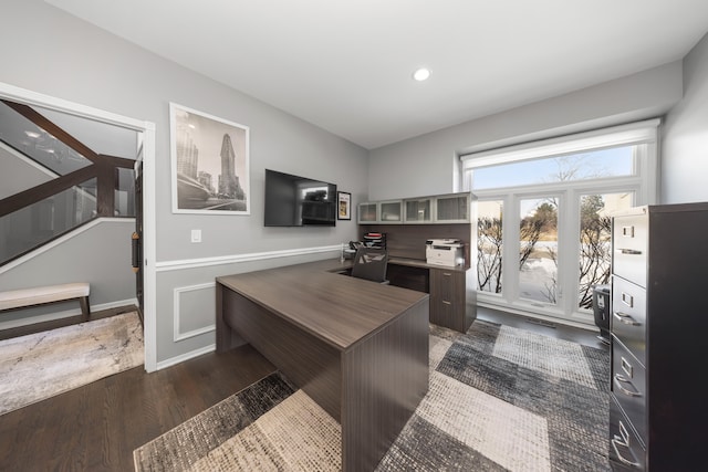 home office with recessed lighting, dark wood-style flooring, and wainscoting