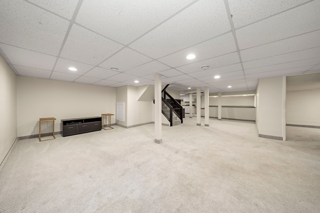 finished below grade area featuring recessed lighting, stairway, carpet, and baseboards