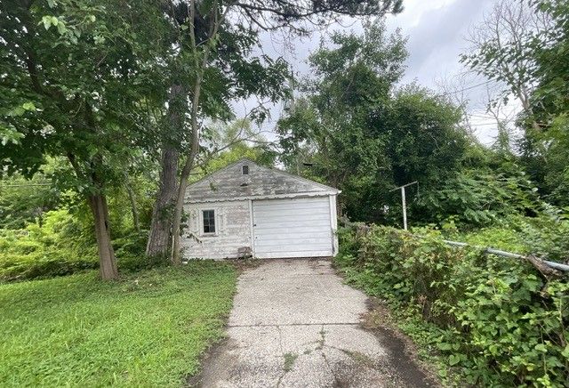 garage featuring driveway