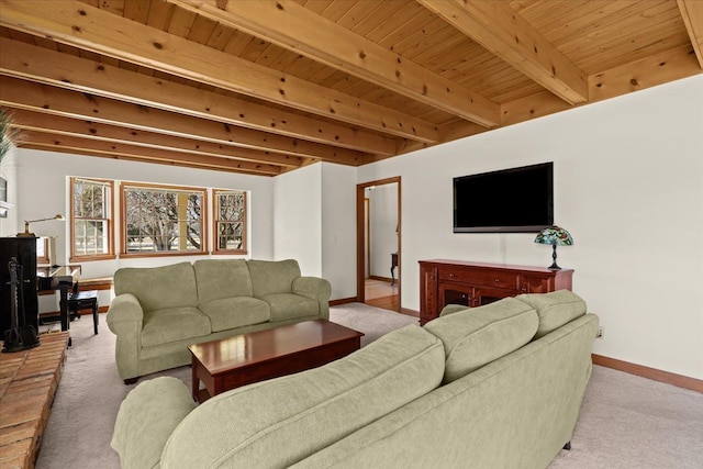 living area featuring beamed ceiling, carpet floors, and baseboards