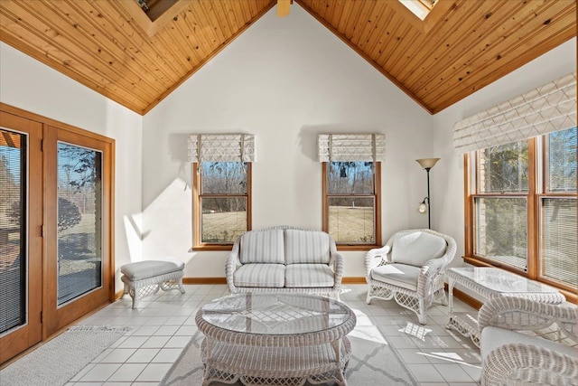 sunroom with lofted ceiling with skylight and wooden ceiling