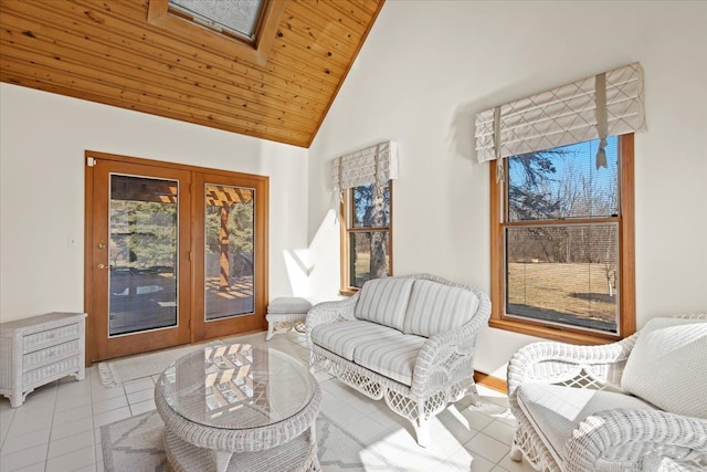 sitting room featuring tile patterned floors, wooden ceiling, and high vaulted ceiling