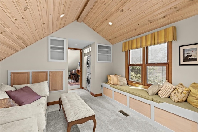 bedroom featuring visible vents, carpet floors, lofted ceiling with beams, stacked washer and clothes dryer, and wooden ceiling