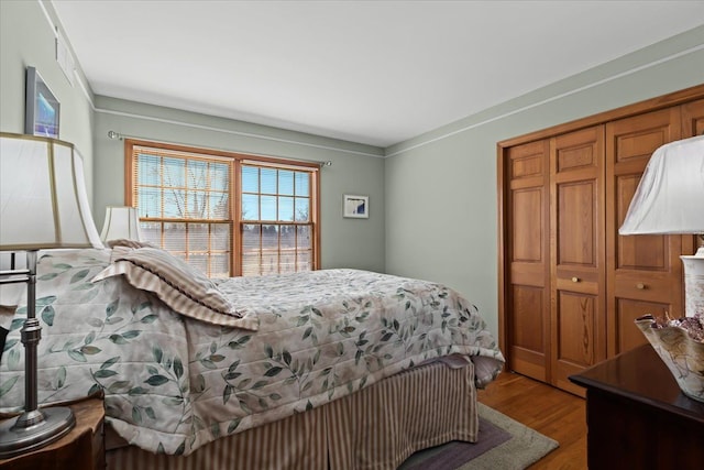bedroom with a closet and wood finished floors