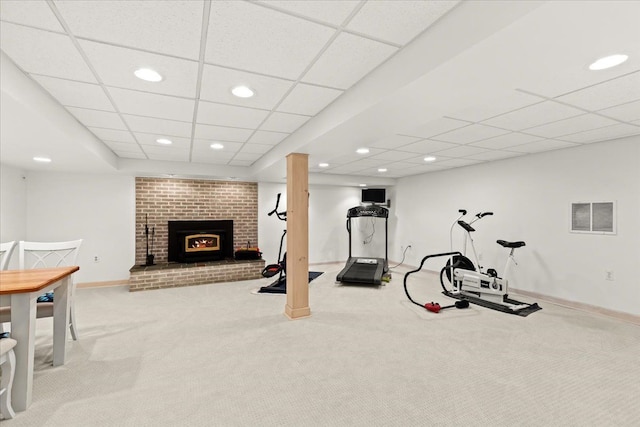 workout room featuring visible vents, baseboards, carpet flooring, recessed lighting, and a fireplace