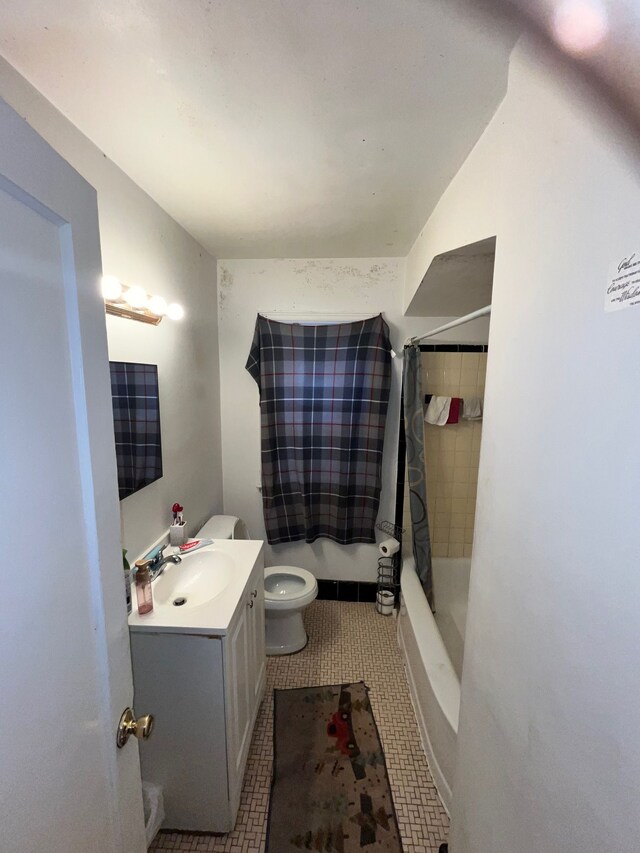 full bathroom featuring toilet, tile patterned floors, shower / tub combo with curtain, and vanity