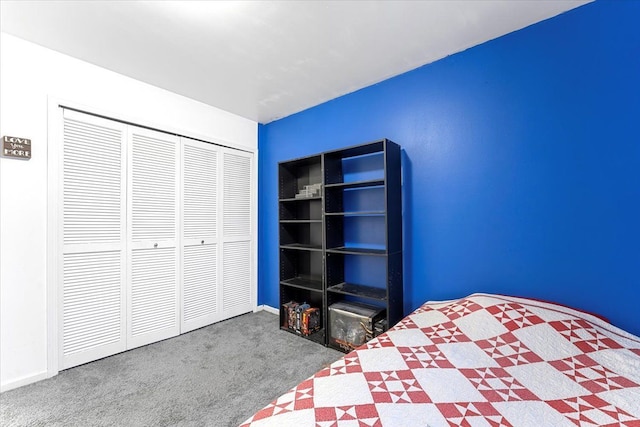 unfurnished bedroom with carpet, baseboards, and a closet