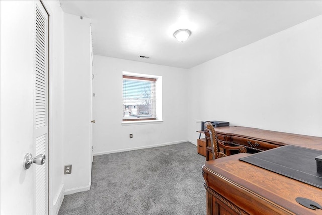 home office with carpet, visible vents, and baseboards