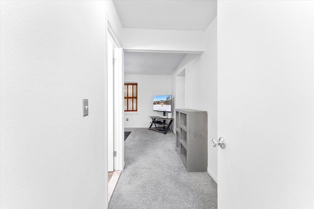 hallway with light colored carpet