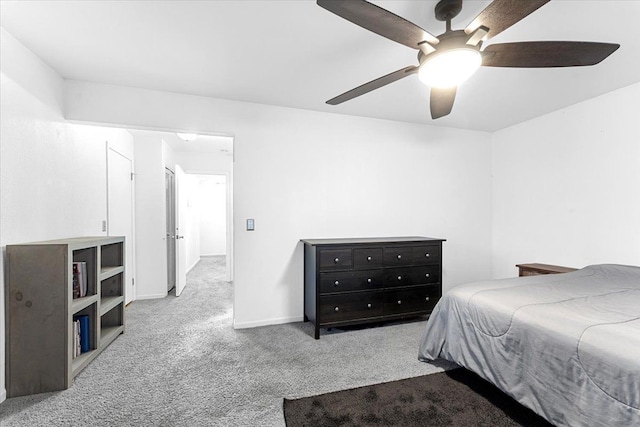 bedroom with carpet floors, baseboards, and a ceiling fan