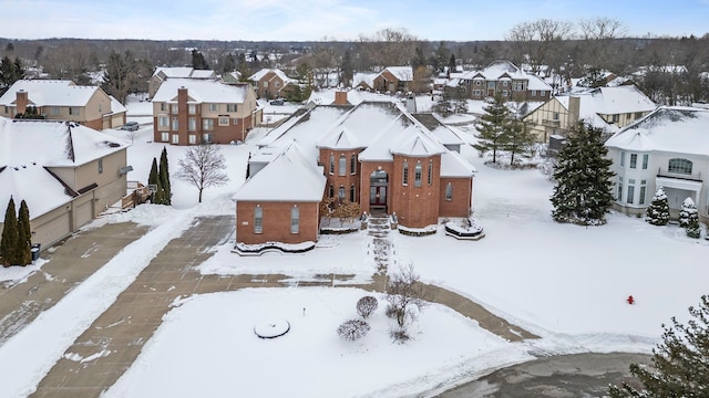 snowy aerial view featuring a residential view