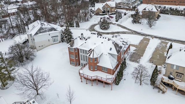 snowy aerial view with a residential view