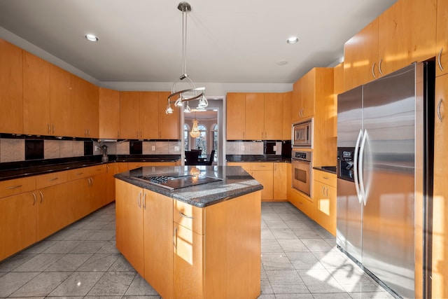 kitchen featuring decorative light fixtures, recessed lighting, backsplash, appliances with stainless steel finishes, and a kitchen island