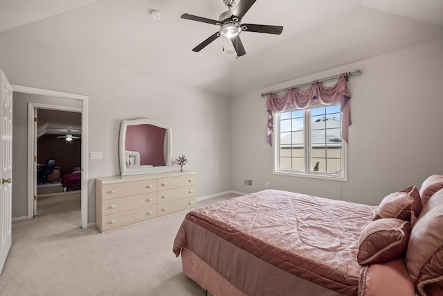 bedroom with a ceiling fan, lofted ceiling, light carpet, and baseboards