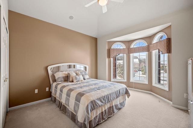 bedroom featuring lofted ceiling, carpet floors, a ceiling fan, and baseboards