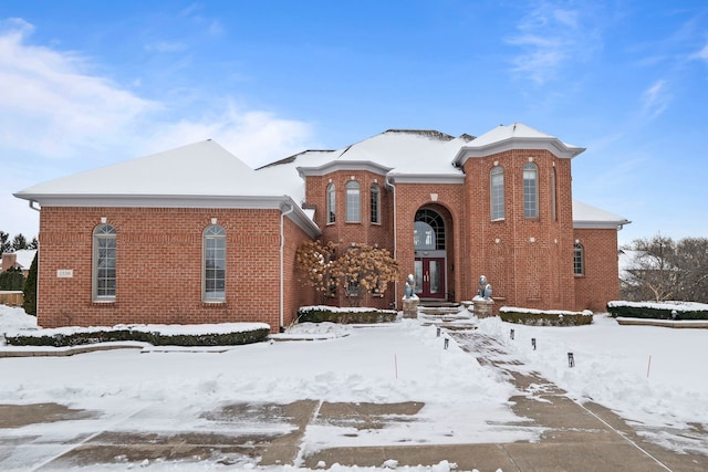 view of front of home with french doors and brick siding