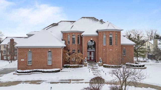 view of front of house featuring french doors and brick siding