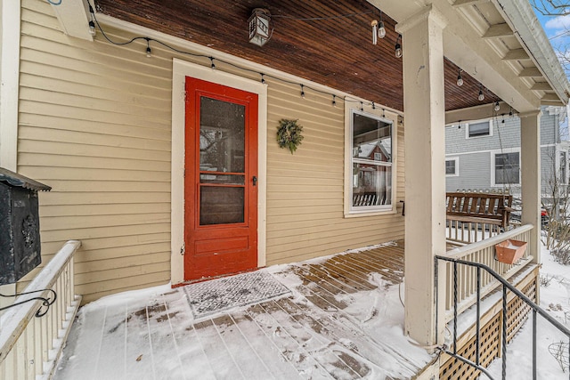 view of snow covered property entrance