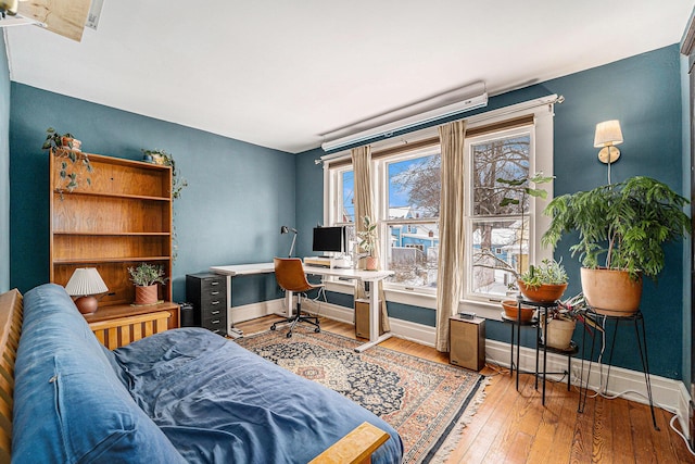 office space with wood-type flooring and baseboards