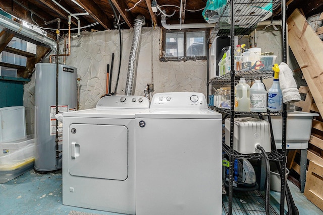 laundry room with independent washer and dryer, laundry area, and gas water heater