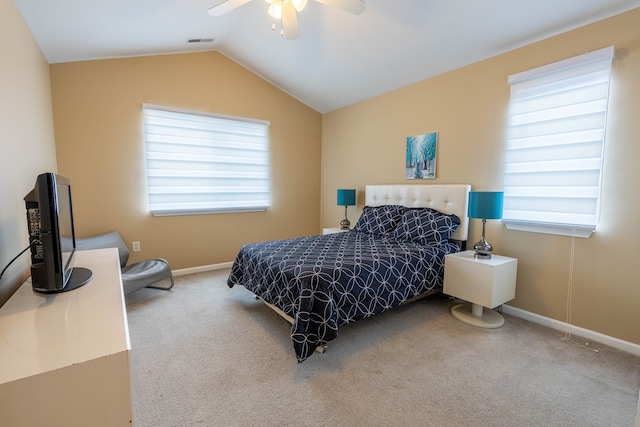 bedroom with carpet floors, lofted ceiling, visible vents, a ceiling fan, and baseboards