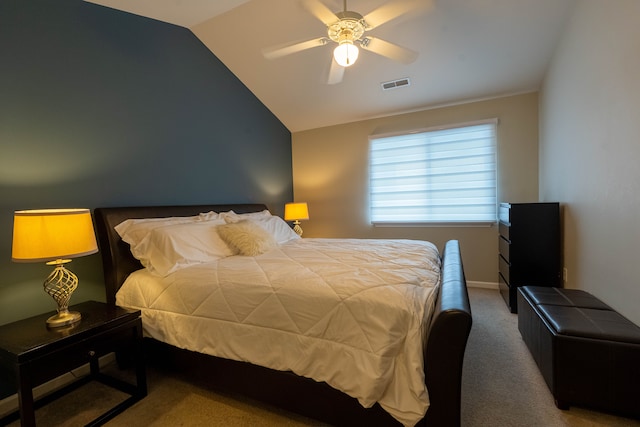 carpeted bedroom with lofted ceiling, visible vents, and ceiling fan