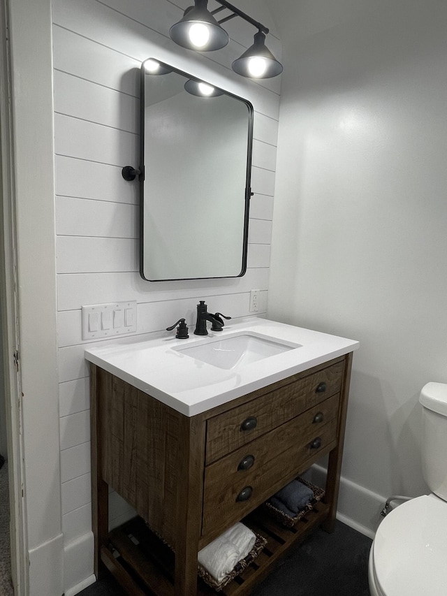 bathroom with toilet and vanity