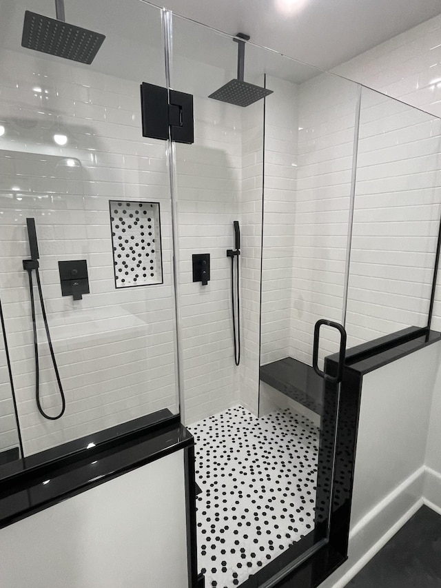 bathroom featuring a shower stall