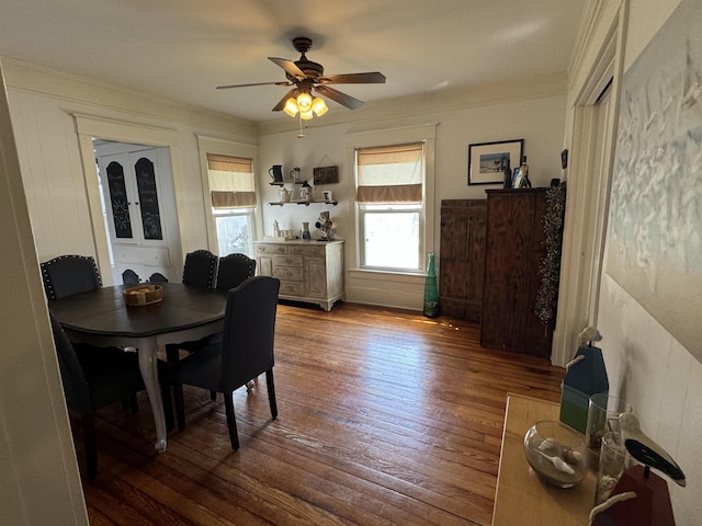 dining room with ornamental molding, ceiling fan, and hardwood / wood-style floors