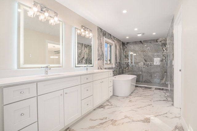 bathroom with double vanity, a marble finish shower, a soaking tub, marble finish floor, and a sink