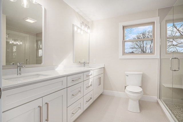 full bath featuring double vanity, tile patterned flooring, a sink, and a shower stall