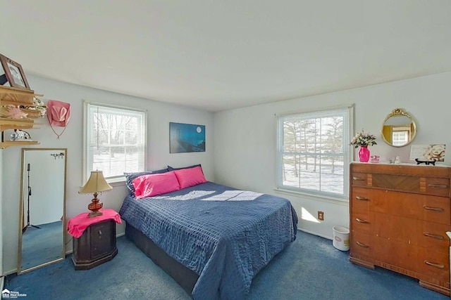 bedroom featuring dark carpet