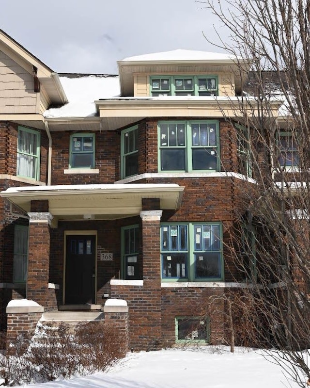 view of front of house with brick siding