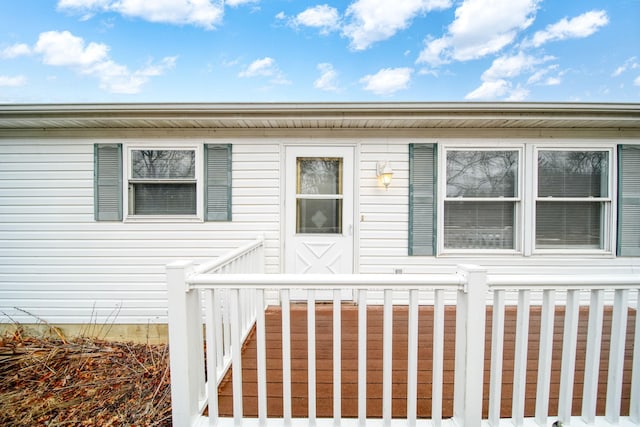 entrance to property with a deck