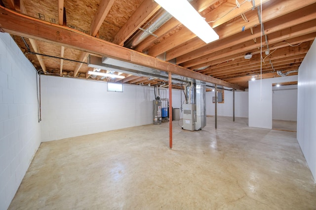 basement with water heater and heating unit