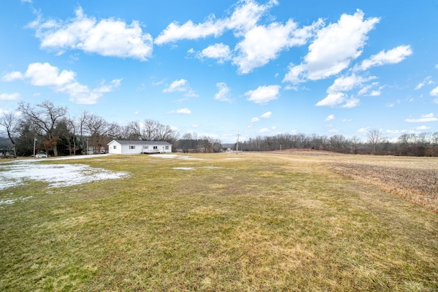 view of yard with a rural view