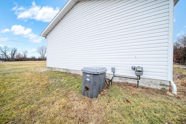 view of side of home featuring a lawn