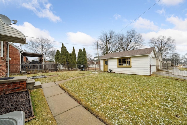 view of yard featuring an outdoor structure and a fenced backyard