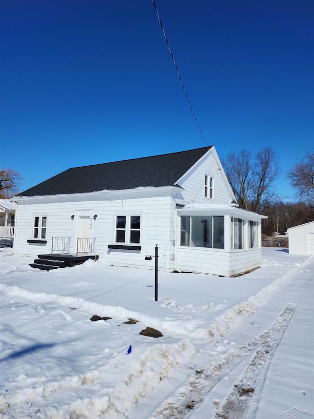 view of front of house featuring a sunroom